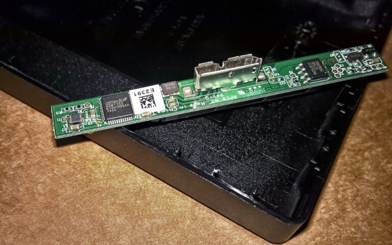 ASMedia ASM1153 USB3.0 to SATA Bridge Controller on the adapter board of a Seagate Slim Backup Plus Portable Drive (Mode